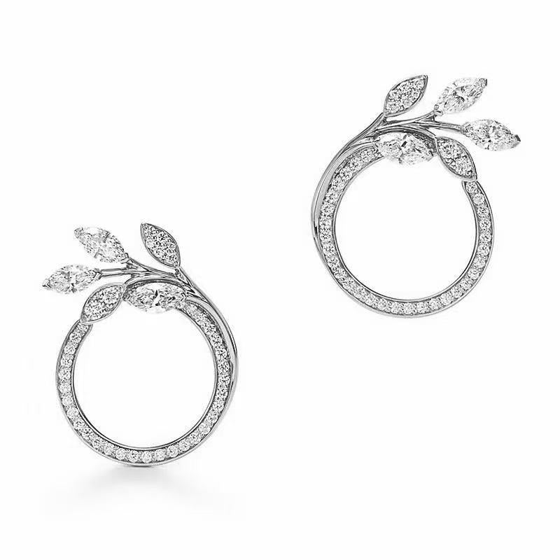 Twisted Leaf Cubic Zirconia Earrings: 24K Gold Plated Brass with AAA CZ