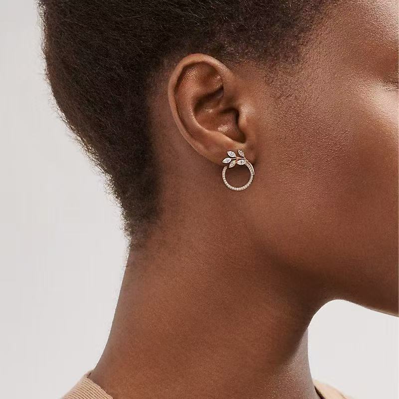 Twisted Leaf Cubic Zirconia Earrings: 24K Gold Plated Brass with AAA CZ