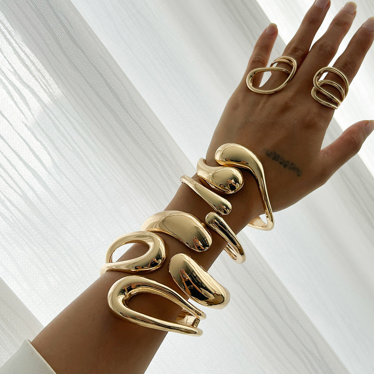 Futuristic Smooth Geometric Bracelet with Droplet Texture